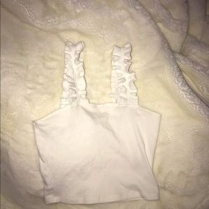 Cropped ruffle strap tank top.